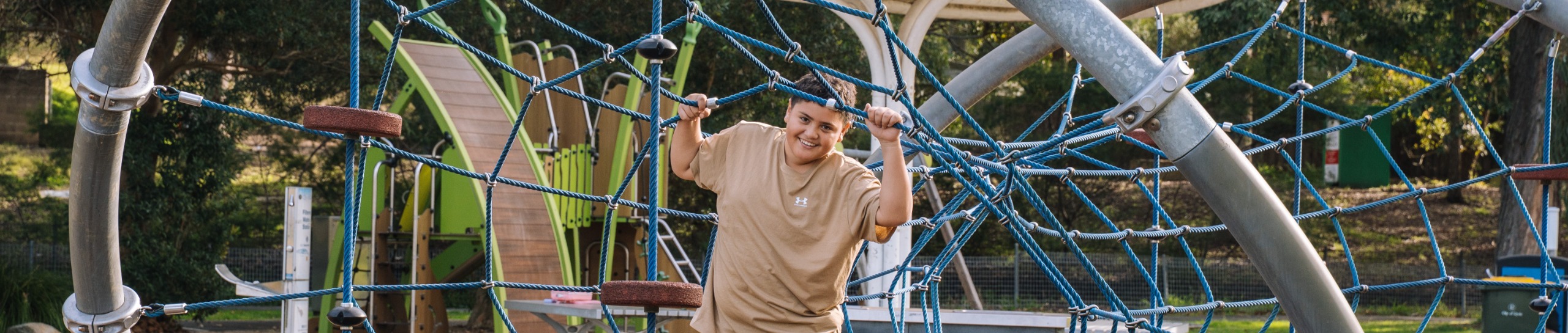 Child smiling on play equipment